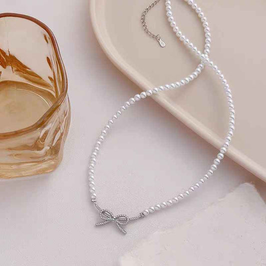 "Charming Pearl & Gold-Plated Bow" Necklace - Delicate, Sweet, and Versatile