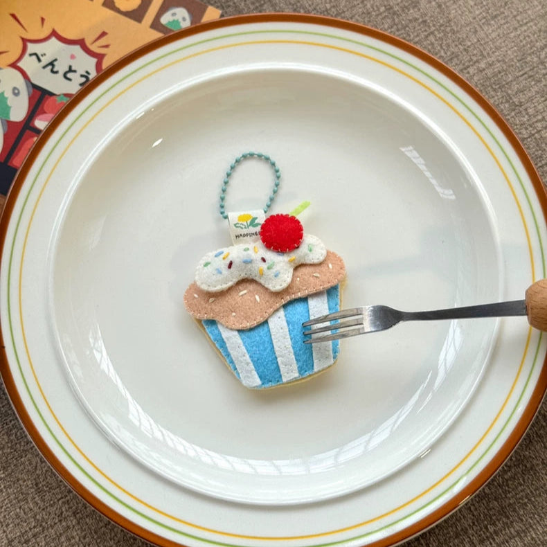 Cupcake-shaped cookie on a plate with a fork